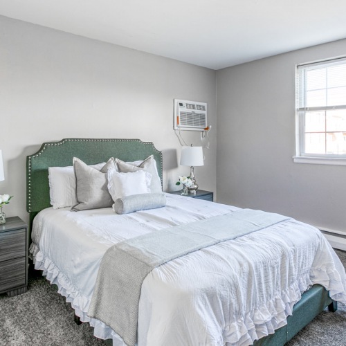Bedroom with natural lighting and high ceilings