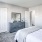 Bedroom with natural lighting and high ceilings