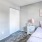 Bedroom with natural lighting and high ceilings